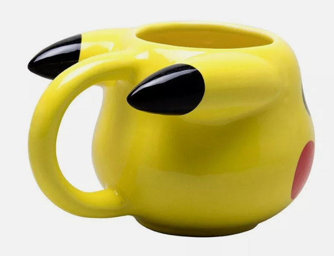 Back View of Pikachu Mug): Back view of a ceramic Pikachu mug, showing the black-tipped ears and yellow handle, which is shaped to match the contours of Pikachu's head. The mug's design captures Pikachu's distinctive features, with the handle resembling one of Pikachu's ears